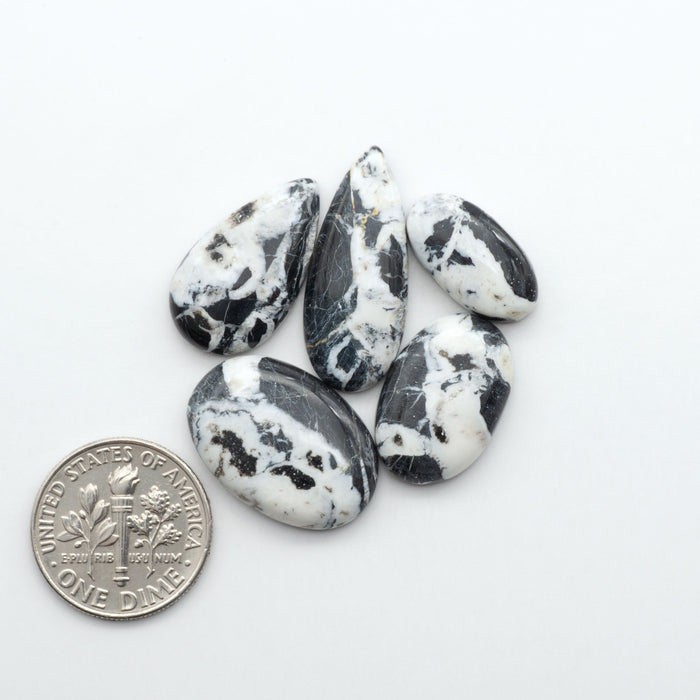 Natural White Buffalo Stone Cabochons are semi-precious gemstones cut into shapes ideal for jewelry-making, making them an excellent choice for artisans.