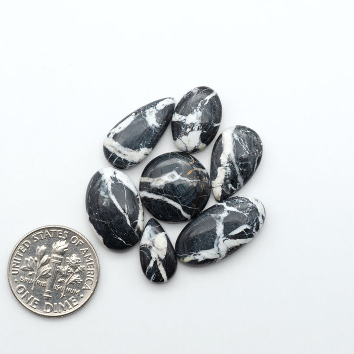 Natural White Buffalo Stone Cabochons are semi-precious gemstones cut into shapes ideal for jewelry-making, making them an excellent choice for artisans.