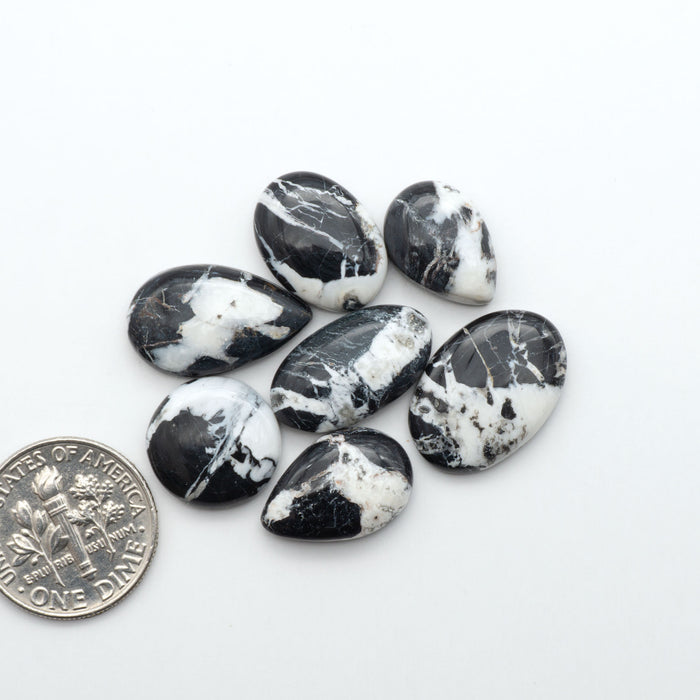 Natural White Buffalo Stone Cabochons are semi-precious gemstones cut into shapes ideal for jewelry-making, making them an excellent choice for artisans.