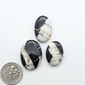 Natural White Buffalo Stone Cabochons are semi-precious gemstones cut into shapes ideal for jewelry-making, making them an excellent choice for artisans.