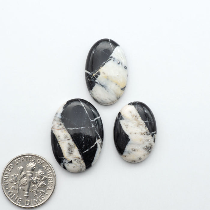 Natural White Buffalo Stone Cabochons are semi-precious gemstones cut into shapes ideal for jewelry-making, making them an excellent choice for artisans.