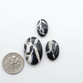 Natural White Buffalo Stone Cabochons are semi-precious gemstones cut into shapes ideal for jewelry-making, making them an excellent choice for artisans.