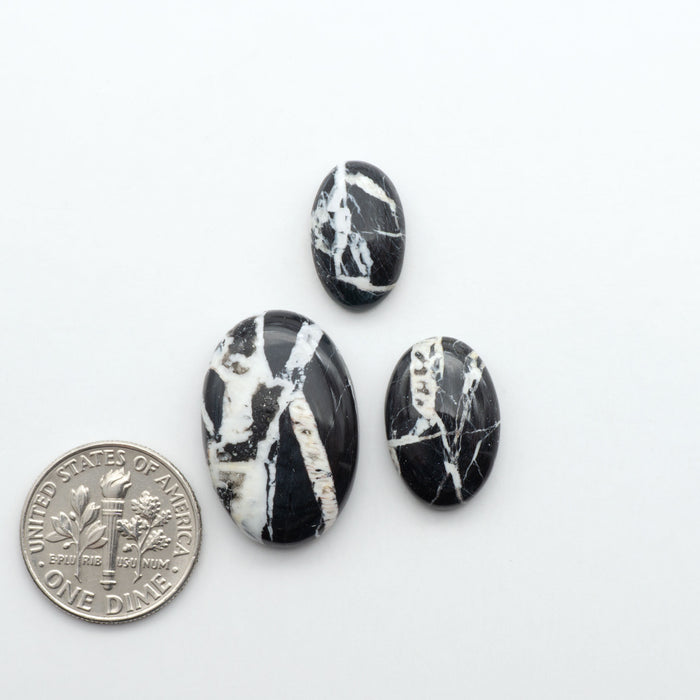 Natural White Buffalo Stone Cabochons are semi-precious gemstones cut into shapes ideal for jewelry-making, making them an excellent choice for artisans.