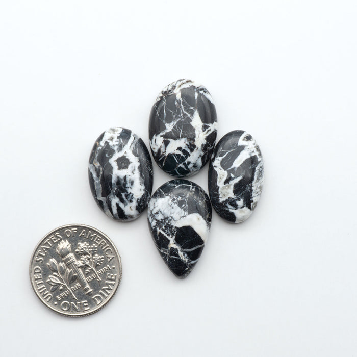 Natural White Buffalo Stone Cabochons are semi-precious gemstones cut into shapes ideal for jewelry-making, making them an excellent choice for artisans.